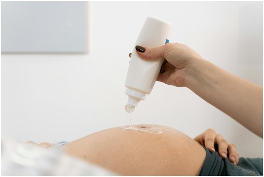 Close-up of a pregnant woman's belly with ultrasou