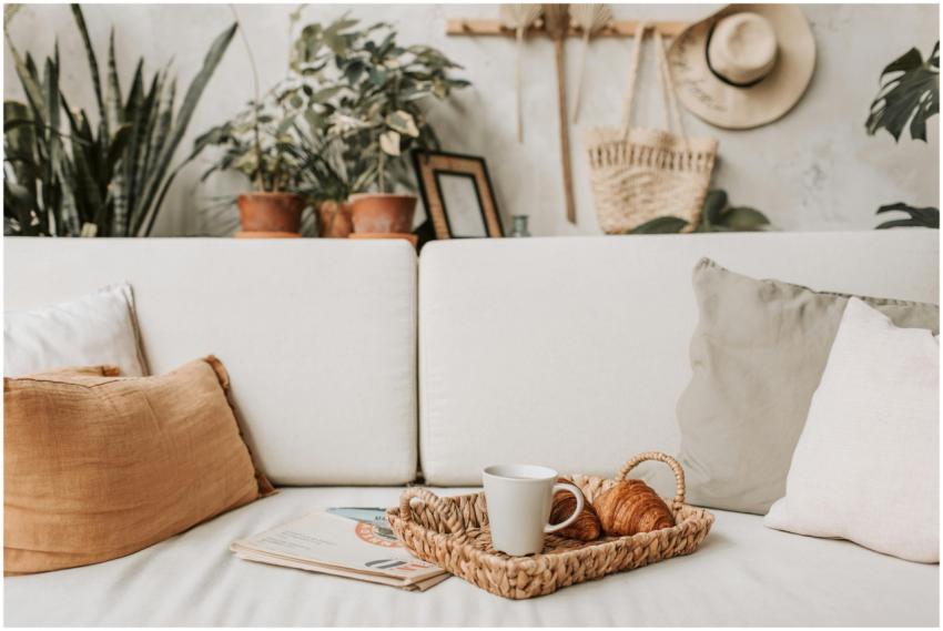 Cozy living room scene with coffee and croissants.