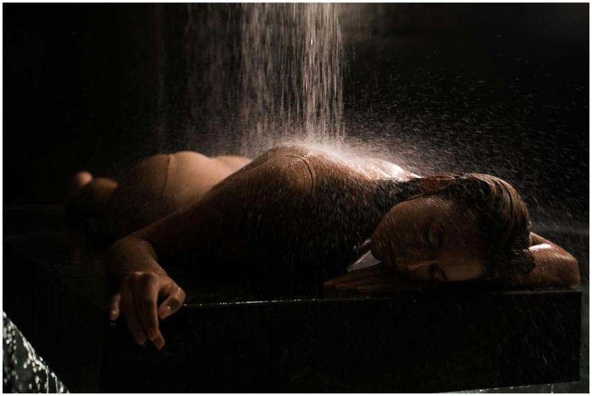 A serene image of a woman receiving a spa water ma