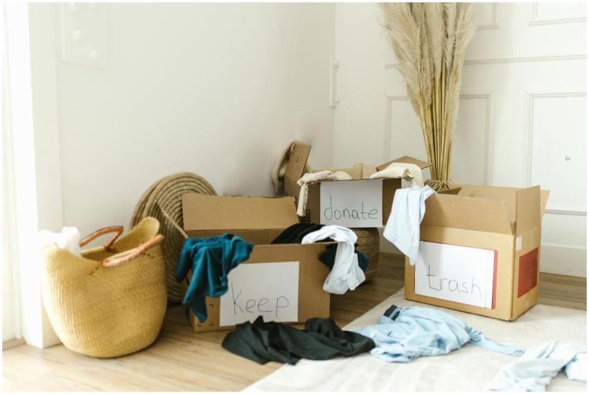 Cardboard boxes labeled 'Keep', 'Donate', and 'Tra