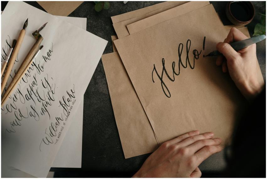 Handwriting with ink on paper in an artistic calli