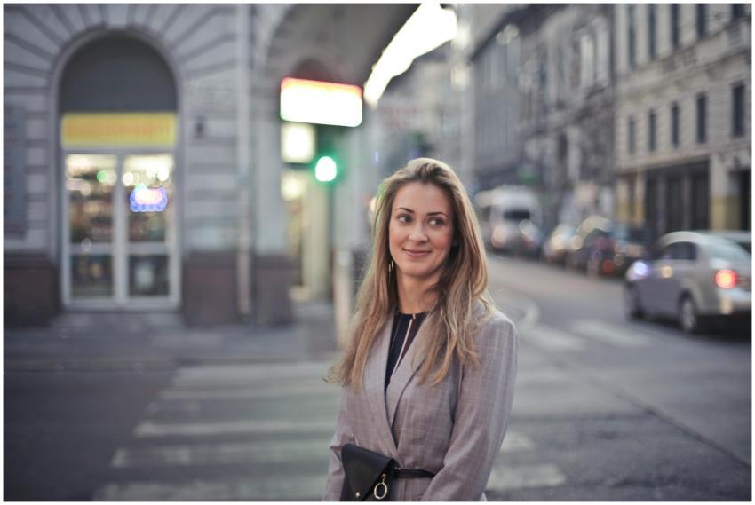 Woman smiling confidently in urban Budapest street