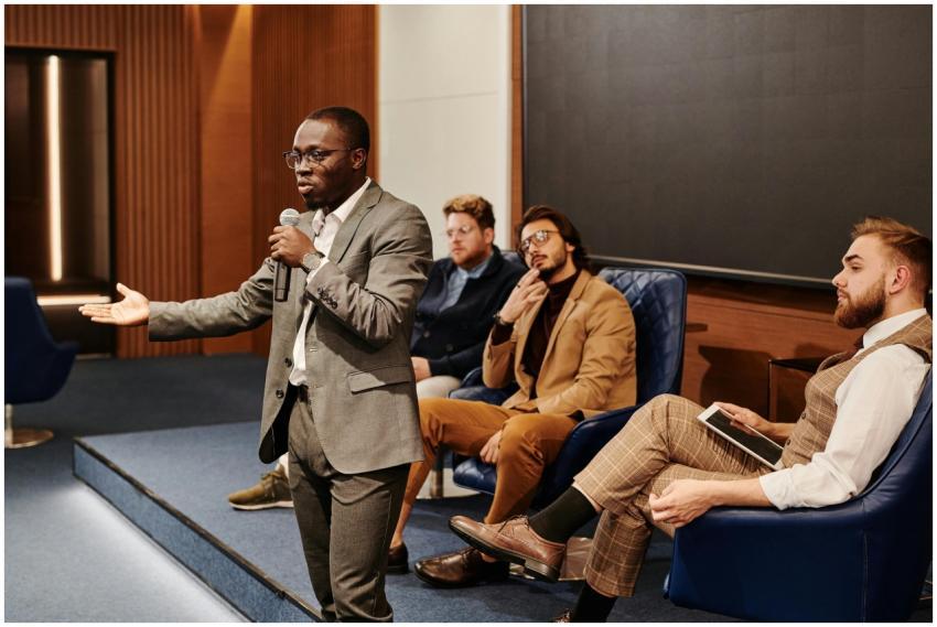 A business professional presenting at a conference