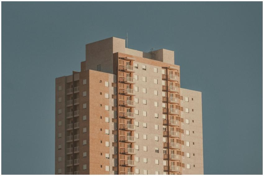 A modern high-rise building with a facade featurin