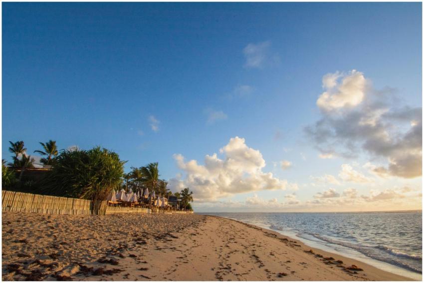 Stunning sunrise over a serene beach in Porto Segu