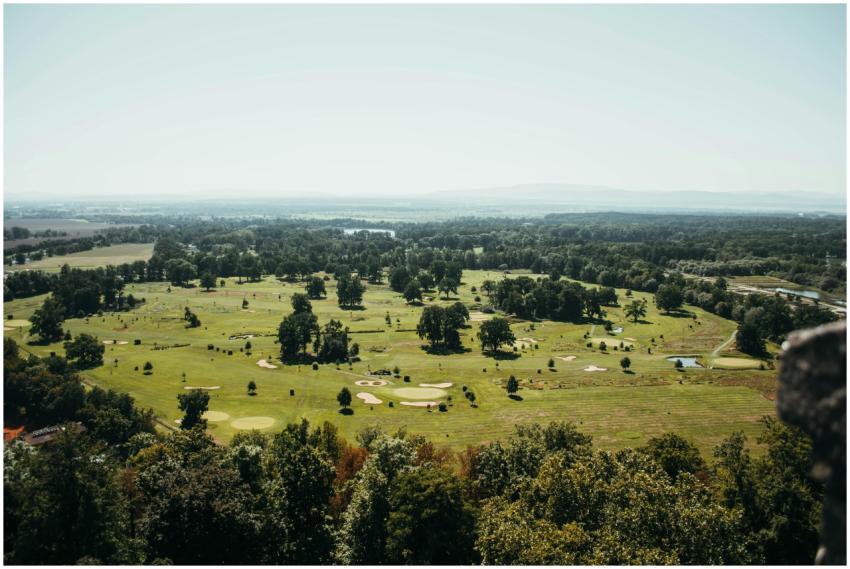 Expansive aerial view of a lush green golf course