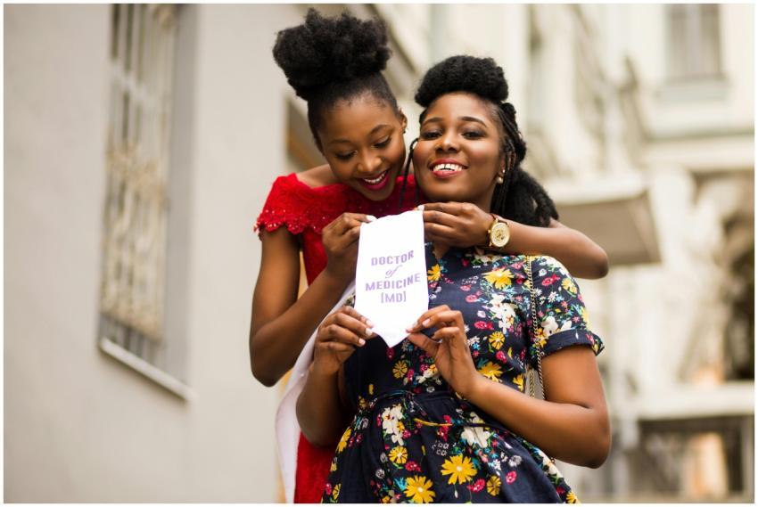 Two women joyfully celebrating medical graduation