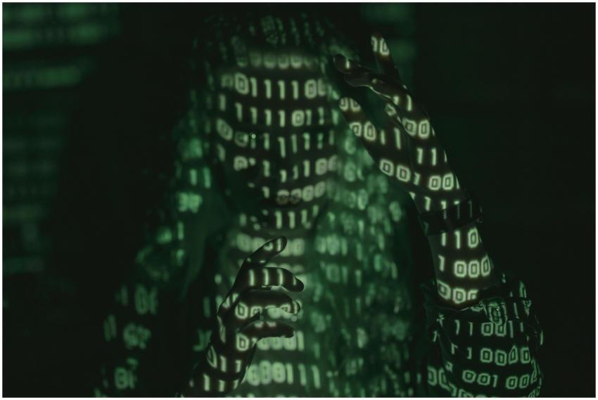 An unrecognizable person with binary code projecte