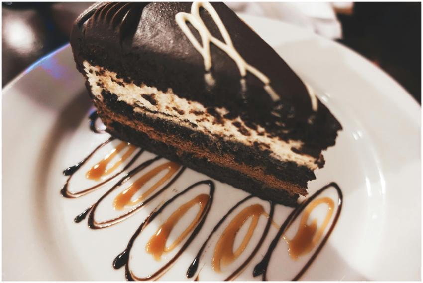 Close-up of a chocolate mousse cake slice with car