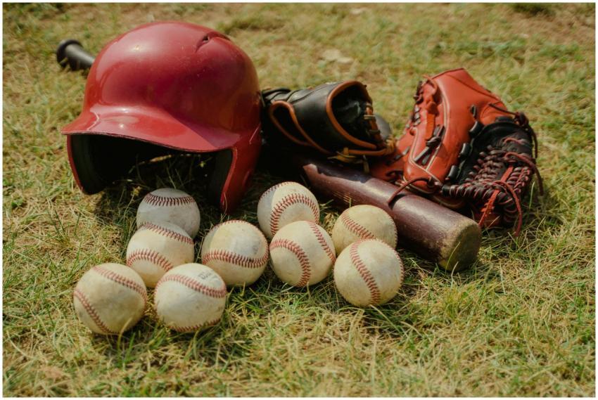 A collection of baseball gear including balls, a b