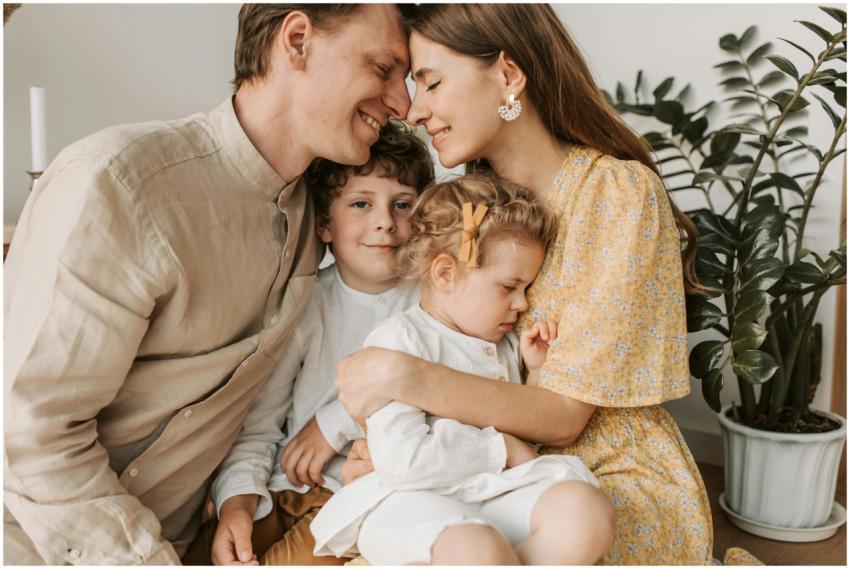 A loving family of four shares a tender moment in