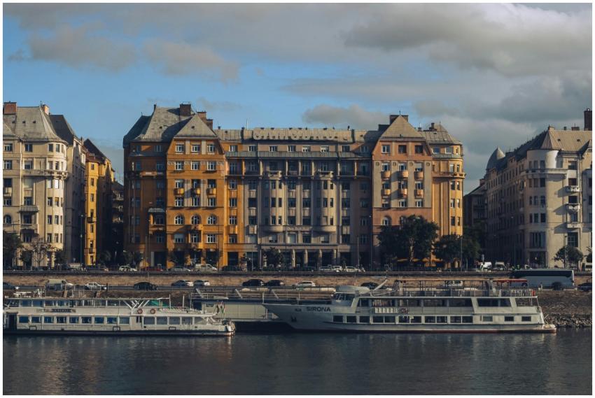 Elegant apartment buildings and boats on the Danub