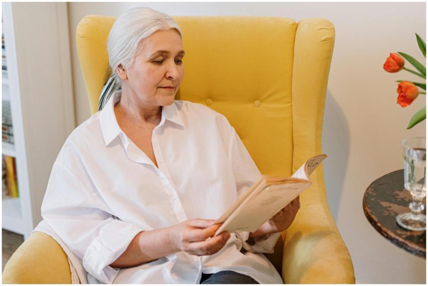 Senior woman enjoying a quiet reading moment in a