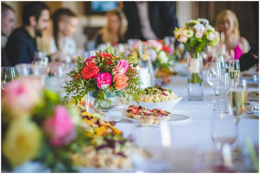 Beautifully set dining table with vibrant floral a