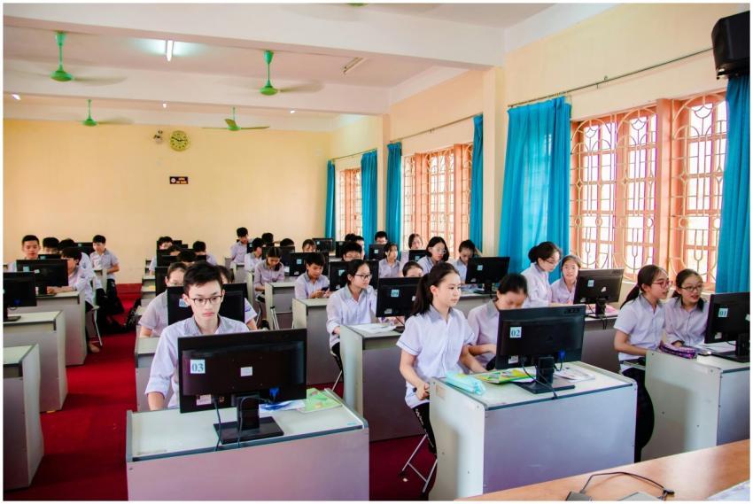 Asian students in uniform learning in a computer l