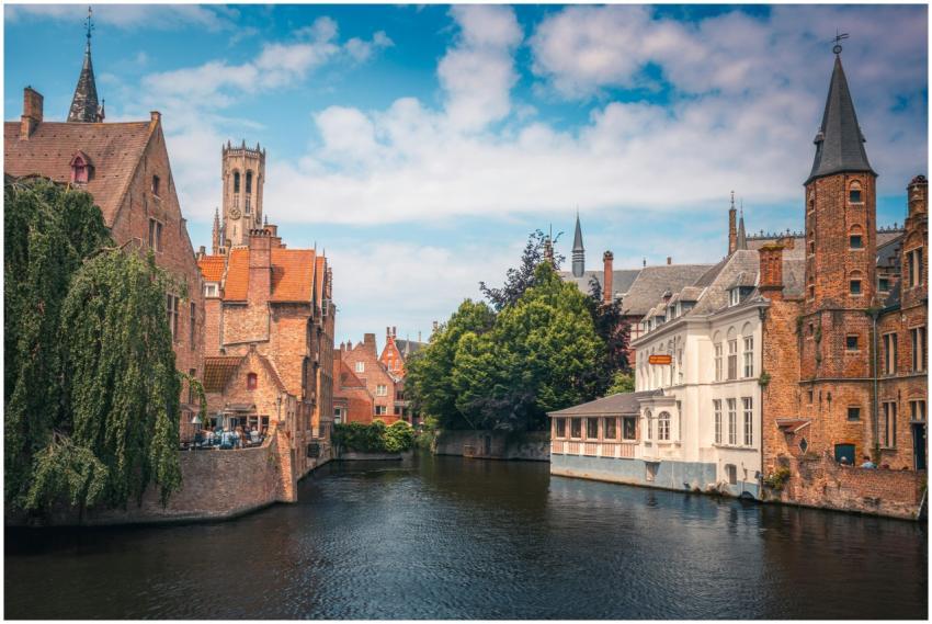 Picturesque view of Bruges canal and medieval arch