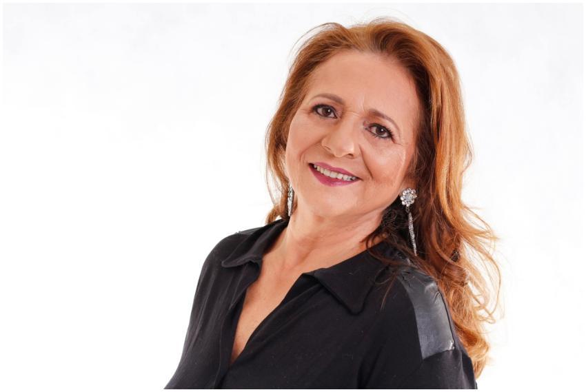 Portrait of a smiling senior woman with long hair