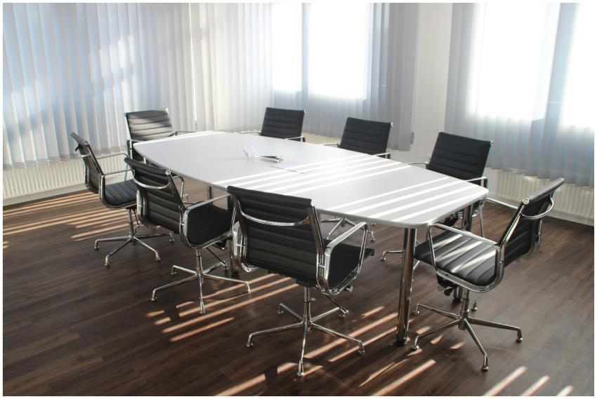 Modern office meeting room with designer chairs, t