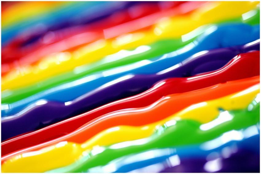 A vibrant abstract background featuring flowing ra