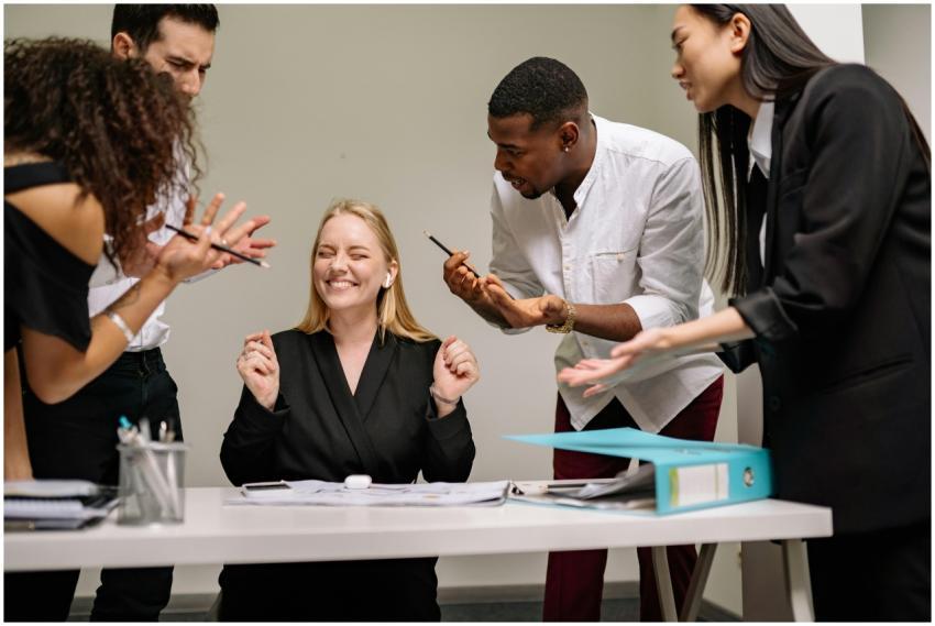 A lively and diverse team collaborates in a modern