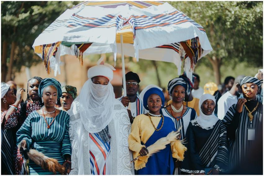 A traditional African ceremony with people in vibr