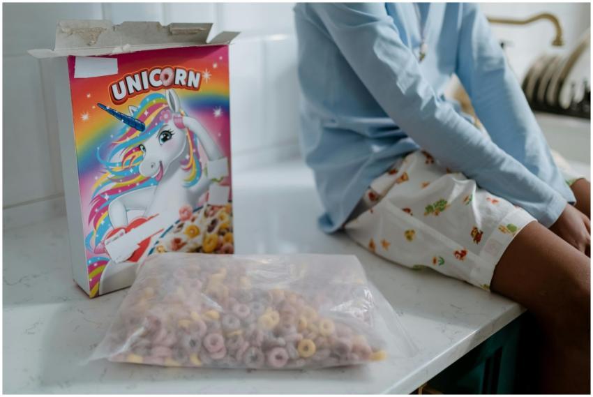 A child sitting on a kitchen counter with an open