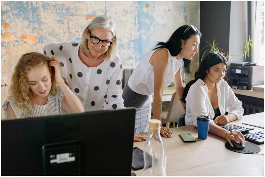 A group of women collaborating in a contemporary o