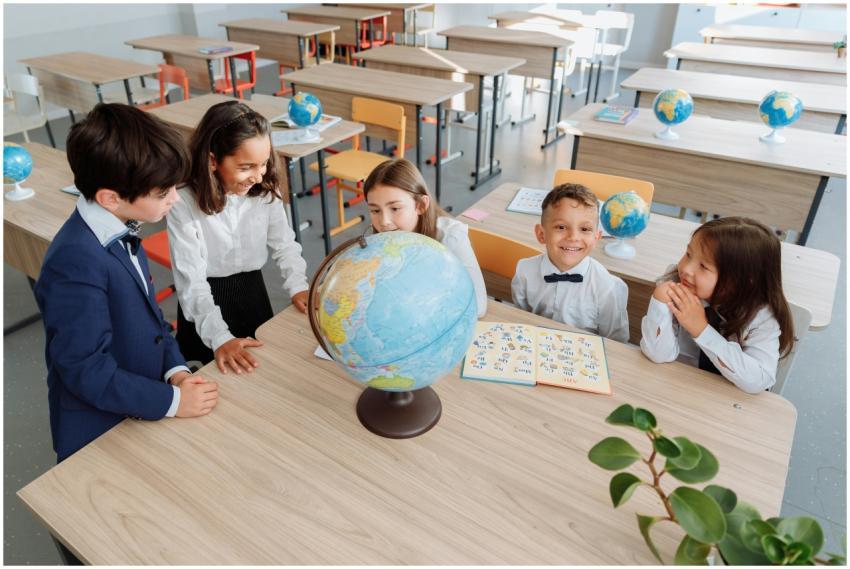 Group of children learning about geography using a