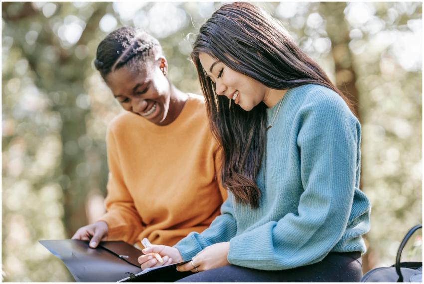 Happy smiling young multiracial female friends in