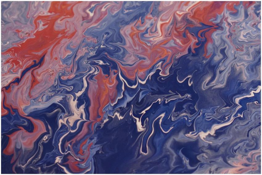 Dynamic swirls of blue and red acrylic paint creat