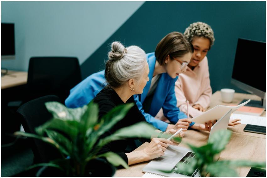 A diverse group of professionals collaborate on a