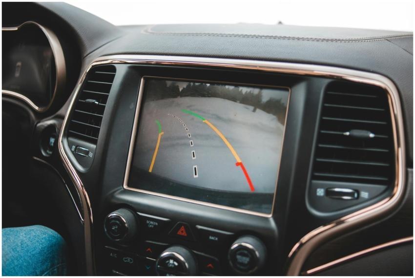 Close-up of a car's dashboard showing a rearview c