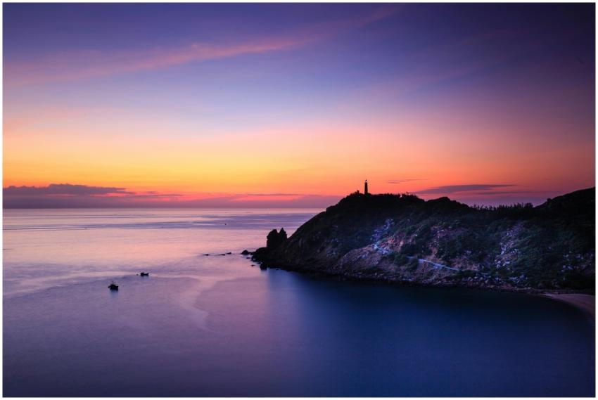 Breathtaking view of a scenic seaside at sunset wi