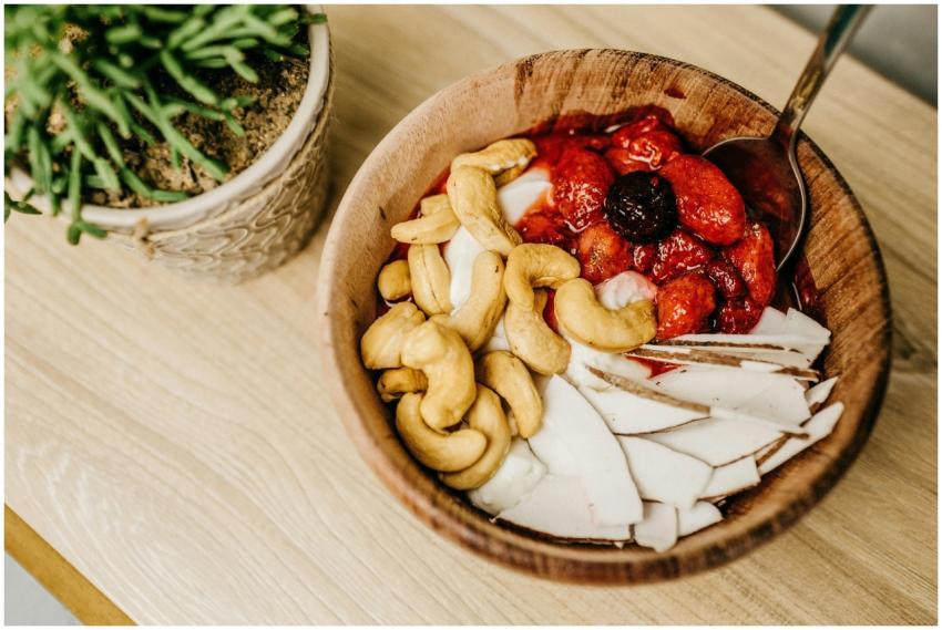 Healthy breakfast bowl with cashews, berries, and