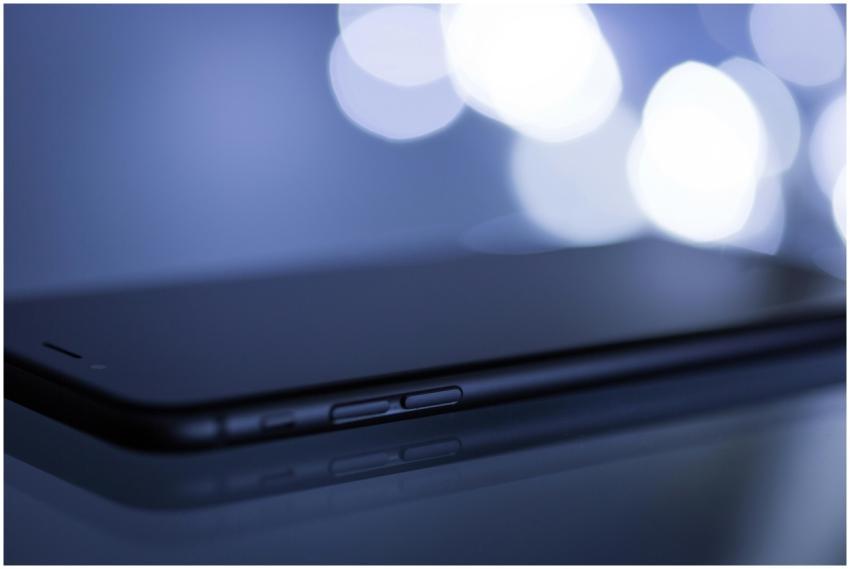 Close-up shot of a sleek smartphone with a blurred