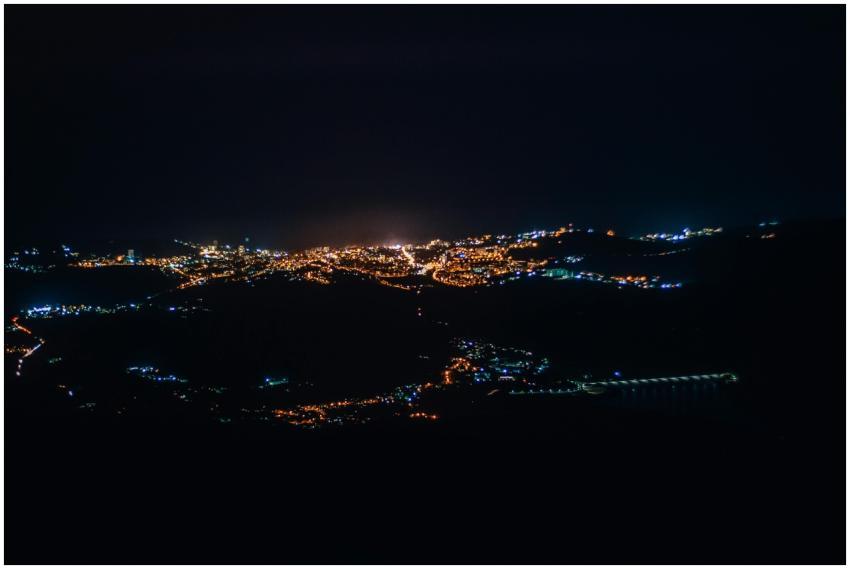 A breathtaking aerial view of a city illuminated b