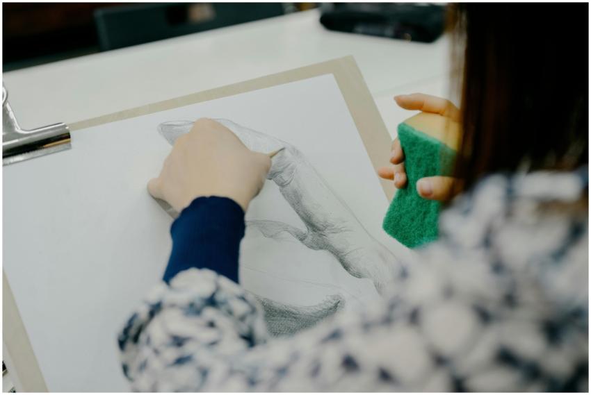 An artist skillfully sketches a hand in a Tokyo st