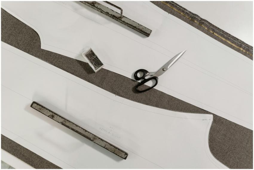 Detailed view of scissors, pattern paper, and fabr