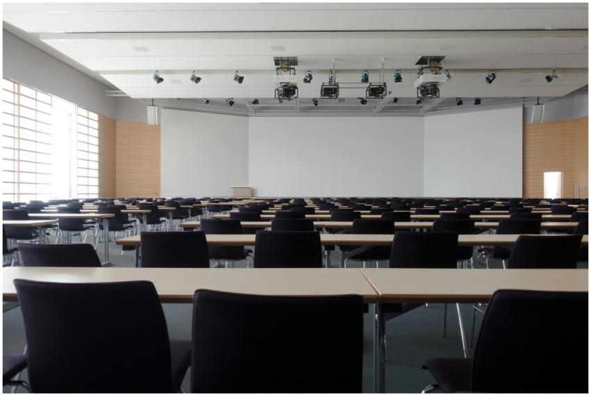 Spacious contemporary conference room with rows of