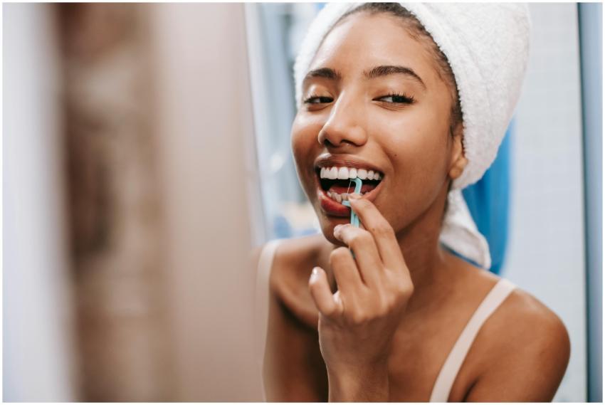Smiling African American female with white towel o