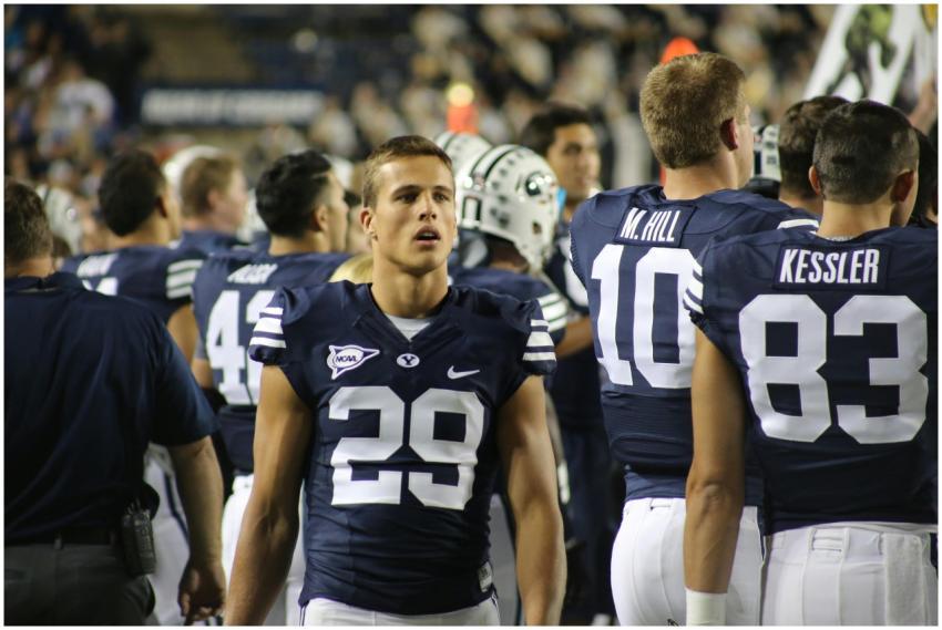 A team of American football players standing on th