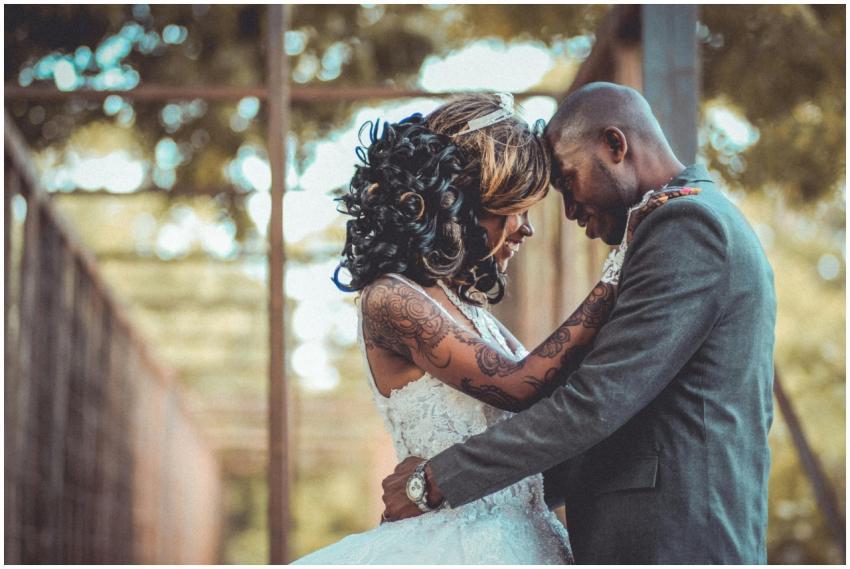 A joyful couple embracing on their wedding day, sh
