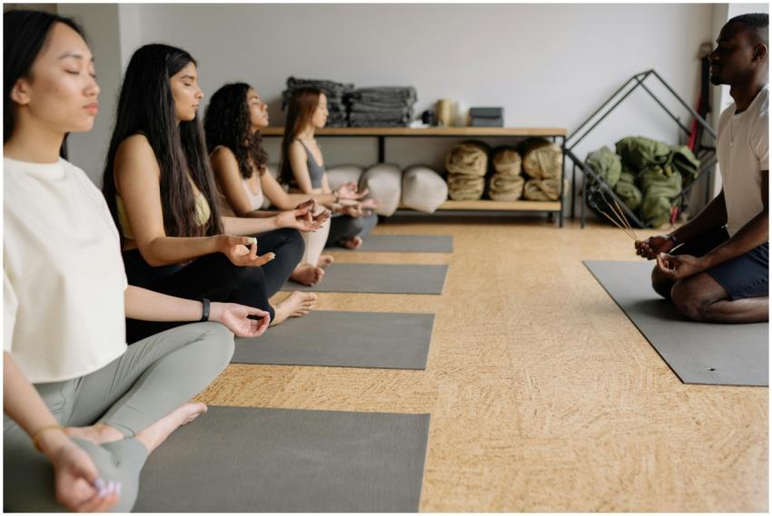 A multicultural yoga class practicing meditation a