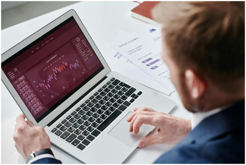 Businessman reviewing data analytics dashboard on
