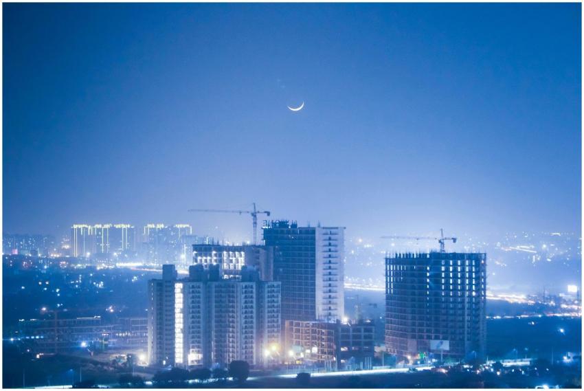 Illuminated cityscape of Greater Noida at night wi