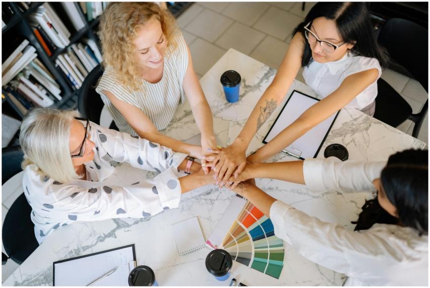 Overhead view of diverse women collaborating in a