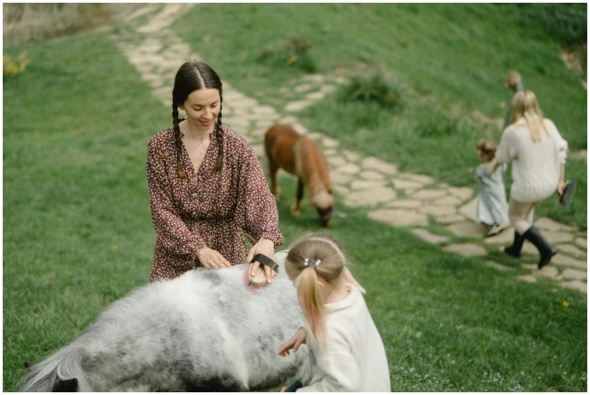 A family spends quality time outdoors grooming pon