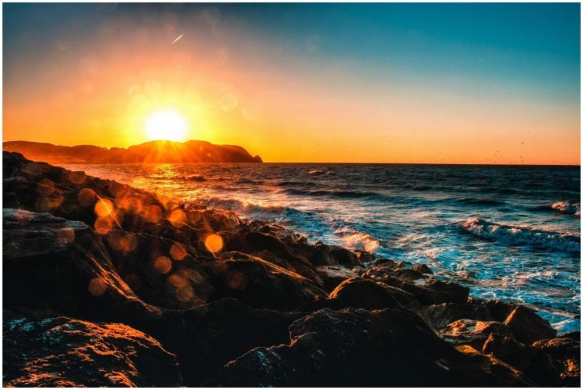 Captivating sunset view over a rocky seashore with