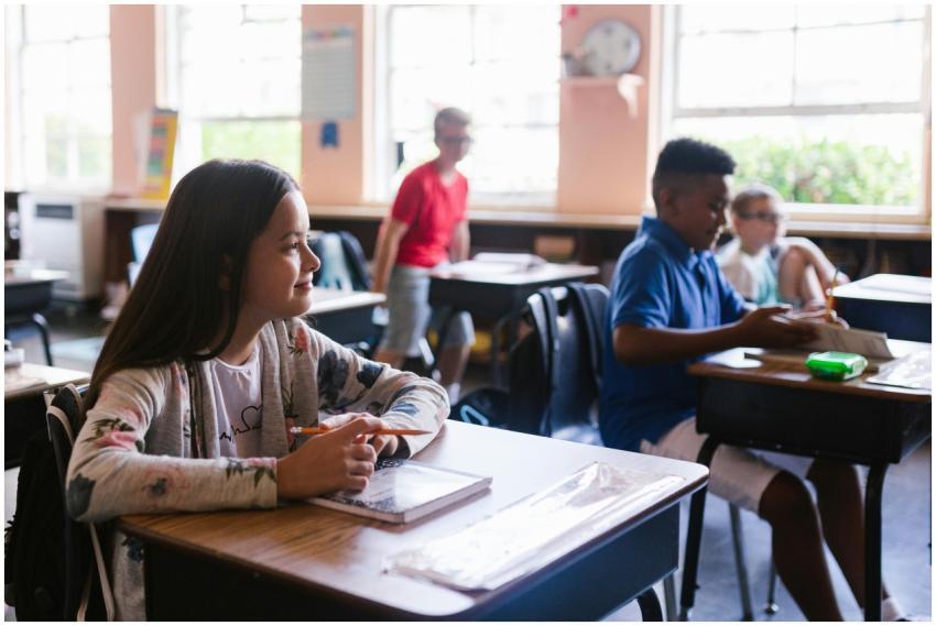 A group of children attentively learning in a brig