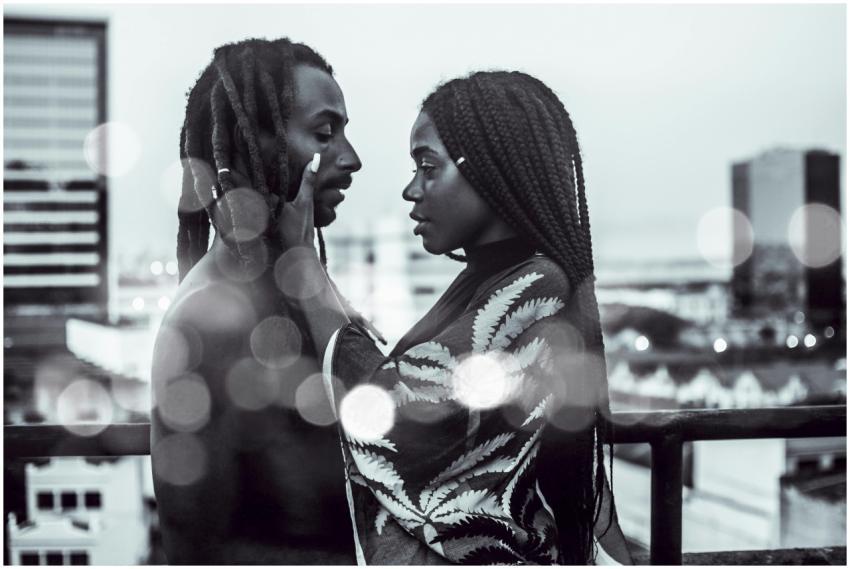 A romantic black and white photo of a couple embra